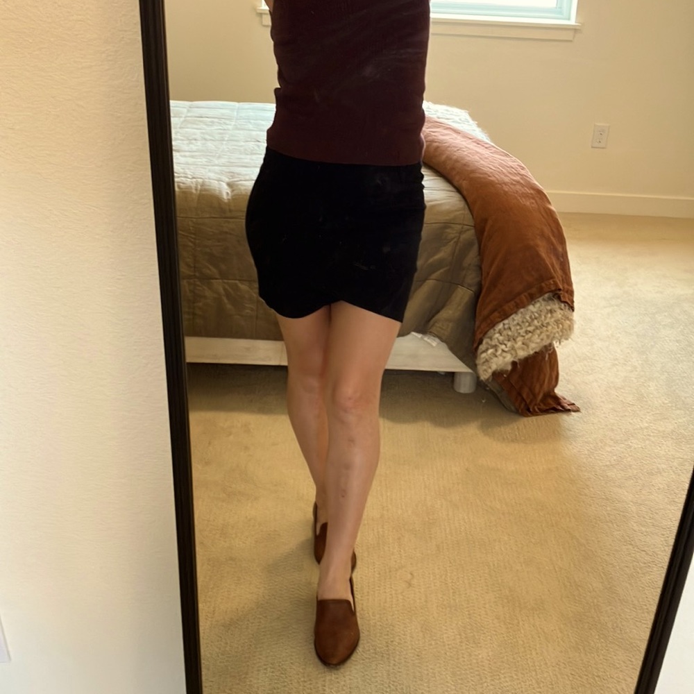 Talula black skirt, above the knee, with crossover detailing in the front